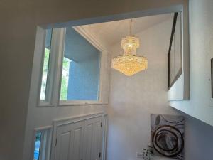 a chandelier is hanging in a room with a door at Asian Oasis Stunning Canyon Views - Luxury Home in Glendale