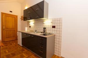 a kitchen with a sink and a counter top at Apartman Miramare in Otočac