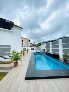 a swimming pool on the roof of a building at Casalavoro apartments in Abuja