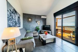 Posezení v ubytování Les Pailles en Queue - Vue mer - Appartements de Charme & Standing