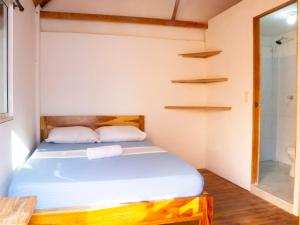 Postel nebo postele na pokoji v ubytování Mithival Beach Rincón del Mar