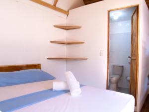 Postel nebo postele na pokoji v ubytování Mithival Beach Rincón del Mar
