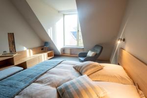 Ein Bett oder Betten in einem Zimmer der Unterkunft TIGNUM - Übernachten mit historischem Flair