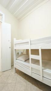 a white bunk bed in a white room at Hostel Canto Zen in Salvador