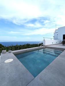 a swimming pool on the side of a house at La Palma Luxury Heritage in Las Ledas