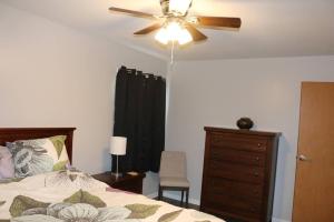 a bedroom with a ceiling fan and a dresser at Rt. 682 Athens, 3 Queen bedrooms, 2 baths, Wi-Fi in Athens