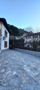 an empty parking lot in front of a building at Marbi Guest House in Gjirokastër