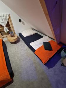 Habitación compartida con 2 camas en Domek rekreacyjny U Marcina, en Kwidzyn