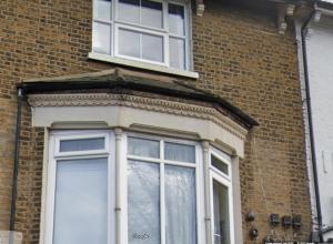 a window on the side of a brick building at 1 Bed Apartment in London, 10 minutes from London Bridge in London