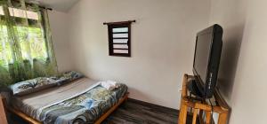 Ένα ή περισσότερα κρεβάτια σε δωμάτιο στο Hana Logde PAMATAI
