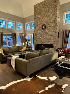 a living room with a couch and a fireplace at Villa Stø in Vesterålen (Lofoten) Norway in Stø