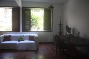 En eller flere senge i et værelse på Loft delícia no Rio de Janeiro