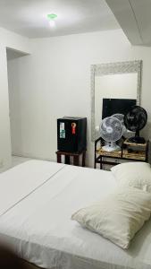 Ένα ή περισσότερα κρεβάτια σε δωμάτιο στο Suite Proximo a Praia