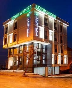 um edifício com uma placa na frente dele em Lenora Airport Hotel em Arnavutköy