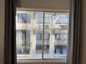 a window with a view of a building at Period Apartment On South Bank in London