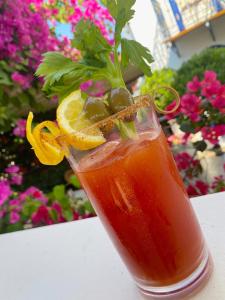 a drink sitting on top of a table at Armata Boutique Hotel in Spetses