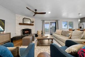 a living room with a couch and a fireplace at Desert Skyline Getaway - An Irvie Home in Tijeras