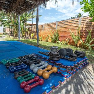 a display of different types of bowling equipment on a table at Casa aloha in Atins