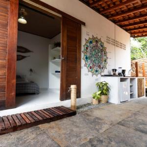 a room with a door and a counter in a house at Casa aloha in Atins