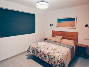 a bedroom with a bed and a large chalkboard at Apartamento en Torre del Mar in Torre del Mar