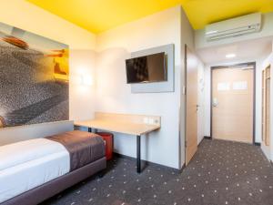 TV o dispositivi per l'intrattenimento presso B&B Hotel Stuttgart-Zuffenhausen