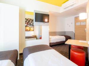 Letto o letti in una camera di B&B Hotel Stuttgart-Zuffenhausen