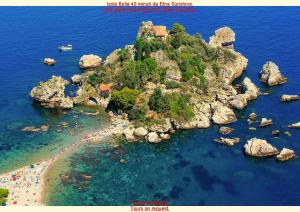 an island in the water with people on a beach at Etna Sunshine Rent Rooms in Puntalazzo