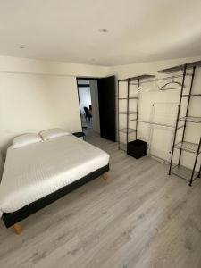 a bedroom with a bed and two bunk beds at Babiloc Moderne à Riez in Riez