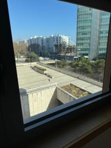 a view from a window of a city street at Expo 53 in Lisbon