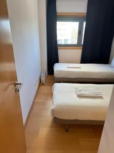 a room with two beds and a window at Expo 53 in Lisbon