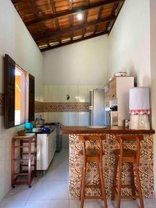 Kuchyň nebo kuchyňský kout v ubytování Casa rustica de Praia em Cumuruxatiba-BA