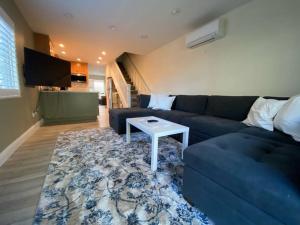 a living room with a blue couch and a table at Newly remodeled condo in Groveland