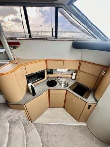 a view of a small kitchen in a boat at Yate Rumbo, casa flotante in Adeje