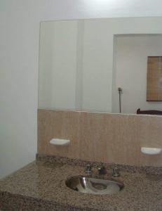 a bathroom with a sink and a mirror at Brisa Serrana in Potrero de los Funes