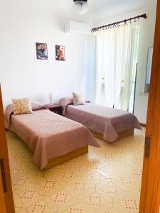 Postel nebo postele na pokoji v ubytování Domus Maris + 10 fotografií