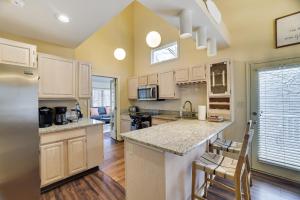 a kitchen with white cabinets and a counter top at Cozy Mountain & Lake Escape: Perfect for Groups in Lake Harmony