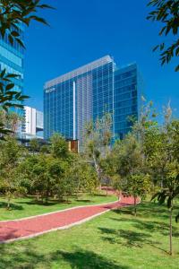 a park in front of a tall building at The Westin Santa Fe, Mexico City in Mexico City
