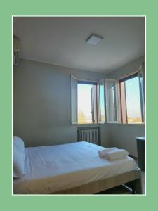 Cama o camas de una habitación en Hotel Cavezzo