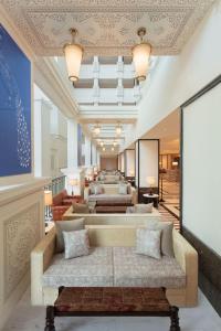 a living room with couches and a ceiling at ITC Narmada, a Luxury Collection Hotel, Ahmedabad in Ahmedabad