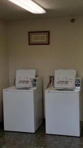 two machines sitting on top of each other in a room at Days Inn by Wyndham Buena Park in Buena Park