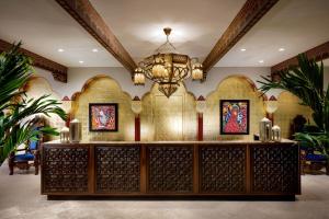 a chandelier hangs above a wine tasting room at Casa Monica Resort & Spa, Autograph Collection in St. Augustine