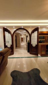 an empty room with an archway in a building at 5star apartment View of the Nile and the pyramids on the Nile Corniche in Cairo