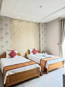 Ένα ή περισσότερα κρεβάτια σε δωμάτιο στο Kim'ss House Hotel