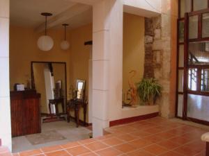 a living room with a wall with a dinosaur on it at Hotel Casolia in Quetzaltenango