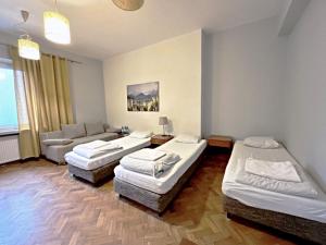 Postel nebo postele na pokoji v ubytování Hostel Helvetia Rooms Warsaw CITY CENTER and OLD TOWN