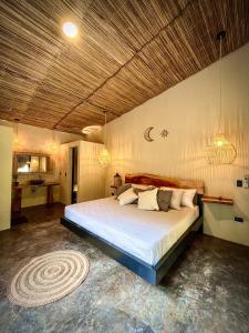 Jungla EcoLuxury Resort tesisinde bir odada yatak veya yataklar