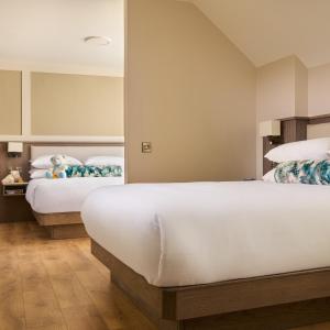 Voodi või voodid majutusasutuse The James Hotel toas