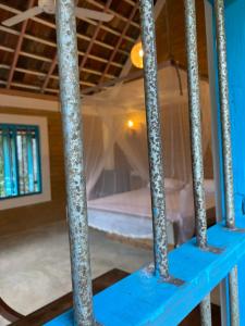 a blue staircase with a bed in a room at Summer Bell Midigama in Midigama