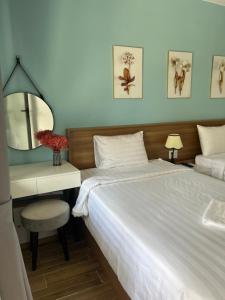 Un pat sau paturi într-o cameră la Rum Resort