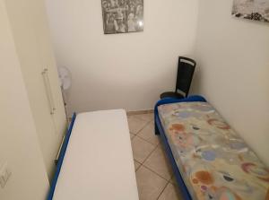 A bed or beds in a room at Grottammare mon amour Kira